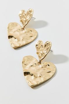 Statement heart earrings in a dangling drop silhouette complete with a hammered finish. Features Hammered hearts earrings Statement drop earrings Heart accent Hammered finish in polished metal Post backing Content + Care Mixed metal Avoid contact with water Imported | Hammered Hearts Earring in Gold, Women's at Urban Outfitters Hammered Gold Earrings, Hearts Earrings, Metal Post, Straw Cowboy Hat, Kate Spade Shoulder Bag, Vintage Kate Spade, Earrings Heart, Mini Hoop Earrings, Statement Drop Earrings