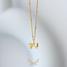 This delicate, feminine bow pendant necklace is made of 925 Sterling Sliver and gold plated.  It can be worn on its own, or stacked with other necklaces.  This necklace is the perfect choice for a variety occasions, whether it is as a birthday, anniversary, or just to mark a significant day, you will have the perfect accessory to make that moment special.  This wonderful piece of jewelry will make a sweet, thoughtful, and precious gift for yourself or that special someone. *Material: 925 Sterlin Gold Necklaces With Butterfly Knot For Gift, Gold Butterfly Knot Necklace For Gift, Gold Necklace With Butterfly Knot For Gift, Delicate Bow Necklace For Gifts, Gold Bow Necklaces For Gifts, Gold Necklaces With Bow As Gifts, Gold Necklaces With Bow For Gifts, Bow Pendant Jewelry For Gifts, Gold Plated Bow Jewelry Gift