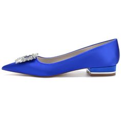 a pair of blue shoes with a jeweled buckle on the toe and heel, against a white background