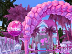 the entrance to barbie's pink palace is decorated with palm trees and balloons in shades of pink