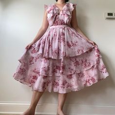 Light Pink And Maroon Floral Tiered Chiffon Midi Dress. Deep Vneck With Ruffles, And An Open Back With A Zipper On The Skirt. The Back Is Apron Style And Connects Straight Down. Super Flowy And Beautiful, Brand New, Originally $279. Great For A Wedding Or Special Occasion. Brand: Nordstrom Size: 2 Measurements: 27” Waist, 15” From Waist To Shoulder, 47” Long Flowy Silk Dress With Ruffles, Sleeveless Silk Chiffon Dress For Summer, Midi Chiffon Dress With Ruffles For Garden Party, Midi-length Chiffon Dress With Ruffles For Garden Party, Sleeveless Chiffon Dress For Daywear, Feminine Georgette Maxi Dress For Summer, Tiered Chiffon Dress For Daywear, Summer Silk Chiffon Dress With Ruffles, Pink Bohemian Chiffon Midi Dress