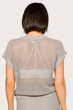 Introducing our Tropez Top, a blend of style and sustainability. This loose-fit top offers a dry hand feel and a silky finish. Meticulously knit to shape, it features a breathable open mesh stitch at the back, dropped armholes for ease of movement, and versatile length, making it your eco-conscious wardrobe essential. Mesh Stitch, Luxury Activewear, Dress Bra, Loose Fitting Tops, Crop Top Sweater, New Tops, Eco Conscious, Running Women, Long Sleeve Crop Top