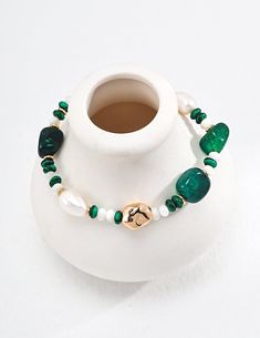 This multi-element bracelet features malachite, pearls and green onyx, among others, harmoniously blending together to create a beautiful accessory. Together, these diverse elements create a bracelet that effortlessly blends elegance, style and a touch of natural charm, making it a versatile and eye-catching addition to any jewelry collection. Metal: 18K Recycled Gold Plated Vermeil on Recycled Sterling Silver Gemstone: Malachite 4mm,Mother of Pearls 4mm,Green Onyx Pearl: Freshwater Pearls 6-10m