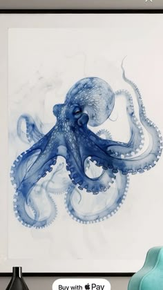 an octopus in blue and white is hanging on the wall above a chair with a black frame