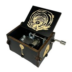 an open wooden box with keys in it