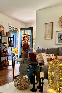 a living room filled with lots of furniture and decor