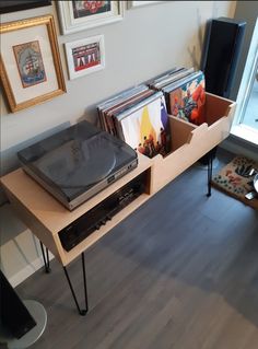 a record player is sitting on top of a table