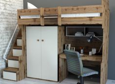 a loft bed with desk underneath it and stairs leading up to the upper floor area