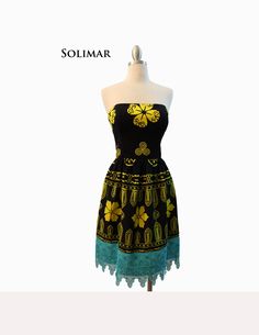 "Solo Mia Designs, my Panama-inspired collection, features imported fabrics.  Some are fabrics used in the everyday clothing of the women of the Guna Tribe of San Blas, Panama.  Items may also include molas, the textile art created by the Gunas.   This strapless dress has a bodice made from black and yellow saburete fabric (used as a wrap skirt by Guna Indian women) and is lined in black satin, with boning for support. The fabric for the skirt is the same as the bodice and it features hand-dyed venice lace in turquoise. The fullness of the skirt is gathered onto the bodice. Measurements: Bust-35.5\" Waist-29.5\" Width at hem-34.5\"( circumference- 69\") Length, waist to hem-17.5\" www.solomiadesigns.com" Black Bohemian Strapless Dress, Black Strapless Bohemian Dress, Everyday Clothing, San Blas, Black And Yellow, Wrap Skirt, Dress Clothes For Women, Houston Tx, Black Satin