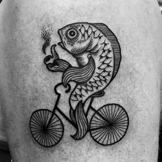 a man's back with a fish riding a bicycle tattoo on his left thigh