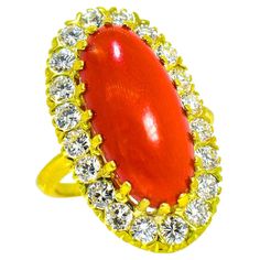 Antique 18K ring centering fine oxblood coral from the Mediterranean. This long oval stone is surrounded with fine white brilliant cut diamonds all hand set in 18K. The ring bears no marks - which is not unusual for this time period. It has been acid tested to confirm its gold content as being 750% pure, 18K. The natural coral in a very pleasing shape, weighs approximately 6 cts and is surrounded by 1.85 cts of fine white brilliant cut diamonds. These diamonds are all well cut, well matched and Natural Pearl Ring, Oxblood Red, Pearl And Diamond Ring, Vintage Style Rings, Coral Ring, Coral And Gold, Coral Stone, Blue Sapphire Diamond, Natural Coral