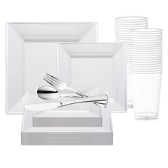 a set of white dishes with silverware and cups on the side, all in different shapes and sizes