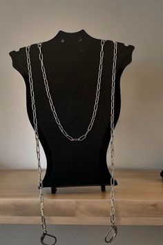 Handmade stainless steel anti loss necklace/ paper clip chain. These chains are the perfect solution for keeping your ear plugs or wireless earphones safe. The necklace has two chains on either side which have lever back fixings or a silicone band for you to attach your Loop ear plugs or AirPods. They would make the perfect gift for Autistics, ADHDers or for anyone who suffers with sensory overload or finds themselves getting overwhelmed.  I started making these earrings after losing several pairs of Loops and AirPods between myself and my daughter. There were plenty of anti loss chain style earrings already for sale but none that matched our style or personalities. I wanted to make something pretty and fun for us and this soon turned into my biggest hyper focus! I love creating these item Hyper Focus, Sensory Overload, Stackable Jewelry, Chain Loop, Silicone Rings, Trombone, Ear Plugs, Silicon Bands, Wireless Earphones