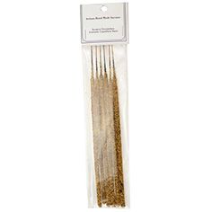 gold glitter sticks in packaging on a white background