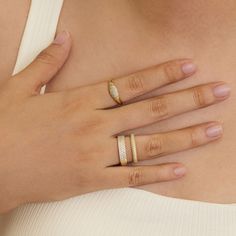 Make a sparkly statement with our signet pinky ring. A classic yet bold ring made with an extremely light-weight design. Best worn with our other daintier rings to create a layering effect. -Made in 18k gold plating- Band thickness: 7.5mm- Hypoallergenic & nickel free If you are in between sizes, we recommend sizing up. Ring Size Chart Classic Open Crystal Ring For Everyday, Trendy Gold Plated Promise Ring, Everyday White Cubic Zirconia Rings, Everyday Gold Plated Open Signet Ring, Trendy Gold-plated Anniversary Rings, Trendy Gold Plated Rings For Anniversary, Trendy Yellow Gold Promise Ring, Trendy Cubic Zirconia Promise Ring, Everyday Yellow Gold Rings With Pave Setting