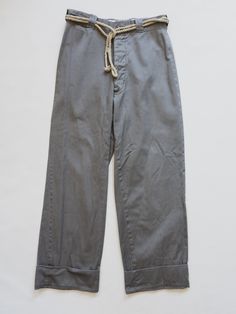 Era : 40's Origin : USA Fabric: Cotton Size : Waist width : 28” Hips width : 21" Rise : 12" Inseam : 30" without cuff Rope Belt Sold Separately ( Shop Here ) Vintage Bottoms With Pockets And Straight Hem, Cotton Wide Leg Selvedge Pants, Selvedge Wide Leg Cotton Pants, Wide Leg Selvedge Cotton Pants, Cotton Selvedge Wide Leg Pants, Selvedge Bottoms With Relaxed Fit For Workwear, Selvedge Relaxed Fit Bottoms For Work, Relaxed Fit Selvedge Bottoms For Work, Vintage Relaxed Fit Pants For Work