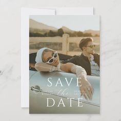 a save the date card with an image of a man and woman sitting in a car