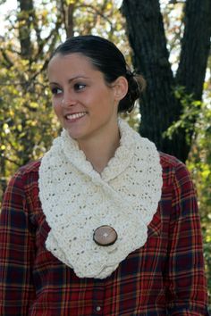 a woman wearing a plaid shirt and a crocheted cowgirl neck scarf