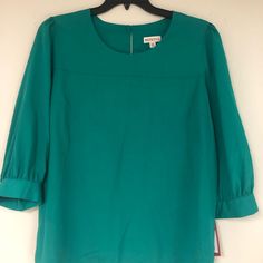 New With Tags Blouse By Merona. Size Xl. Beautiful Teal Color & 3/4 Length Sleeve. Green Half-sleeve Blouse For Spring, Green Half Sleeve Blouse For Spring, Chic Green Half-sleeve Blouse, Chic Green Half Sleeve Blouse, Green Fitted Top With 3/4 Sleeves, Spring Workwear Blouse With 3/4 Sleeves, Chic Green Blouse With 3/4 Sleeves, Elegant Green Blouse With 3/4 Sleeves, Green 3/4 Sleeve Blouse For Fall