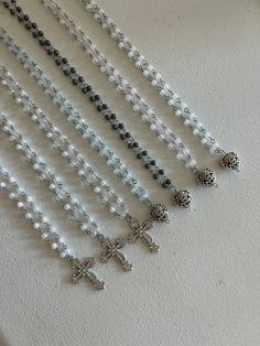 Beaded Cross Necklaces These dainty cross necklaces are fabulous and fun! Add some sparkle to your outfit with this piece. It is available in 2 pendant types and 6 colour ways. Perfect for everyday wear.  Instruction:  1. Please select pendant type (heart or cross)  2. Please select bead colour way. 3. Please select length (most common is 16 inches)  Handmade with Stainless Steel Nickel-free Cross-shaped Faceted Beads For Jewelry Making, Beaded Cross Pendant Necklace As A Gift, Silver Beaded Cross Pendant Necklace, Silver Cross Beaded Necklace For Spiritual Style, Silver Spiritual Cross Beaded Necklace, Spiritual Silver Cross Beaded Necklace, Silver Beaded Cross Necklace For Gift, Beaded Crucifix Necklace, Silver Crystal Beaded Necklace With Gemstone Beads