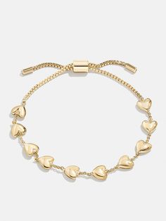 The Brittany Bracelet is the perfect way to add a subtle dose of affection to your curated wrist stack. This bracelet features petite heart adornments with chic negative space in between. Better yet, it's finished off with a pull-tie closure, meaning you'll always get the perfect fit. Baublebar Bracelet, Gold Heart Bracelet, Preppy Jewelry, Cute Bracelet, Boutique Ideas, Jewelry Accessories Ideas, Dope Jewelry, Jewelry Essentials, Stacked Jewelry