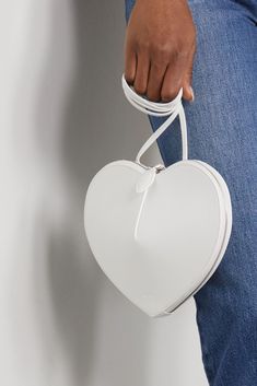 White Le Coeur leather shoulder bag | ALAÏA | NET-A-PORTER Designer White Bags For Gifts, Designer White Bags As Gifts, White Heart-shaped Shoulder Bag For Valentine's Day, White Heart-shaped Shoulder Bag For Daily Use, White Shoulder Bag With Detachable Handle As Gift, White Heart-shaped Everyday Bag, White Shoulder Bag For Valentine's Day, White Crossbody Bag For Valentine's Day, White Shoulder Bag For Valentine's Day Gift