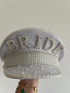 Make the bride feel incredible on her hen party with this stunning bridal hat! This embellished hat is a must-have for any bride to make her feel extra special - plus, it is the perfect instagrammable bridal hat! Style this glamorous bride hat with hen party decorations and accessories from our Hen Weekend collection, perfect for those brides who want a trip away! Each pack contains 1 x Bride to Be hat measuring 28cm (H) x 28cm (W) White Cap Mini Hat For Weddings, Embellished Party Cap, Lace Table Runner Wedding, Hen Party Decorations, Dope Jewelry Accessories, Hen Weekend, Bling Jeans, Pearl Bride, Bride Hat