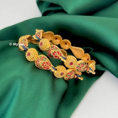 Ruby and green meenakari peacock bangles pair of 4. Inspire your style with antique gold finish hadcrafted indian traditional bangles with enameled meenakari design.   All orders Ship same day if placed before 4:00 PM EST  Create beautiful memory for any occasion with elegant jewelry for your loved ones We will be happy to navigate you through the process so if you have any questions regarding our product before placing an order reach out to us and we will be there to help you.  Thank you for yo Elegant Peacock Design Chandbalis For Festivals, Festival Kundan Bracelets With Motifs, Kundan Bracelets With Motifs For Festivals, Bollywood Style Bangle With Diwali Motifs, Bollywood Style Bangle With Motifs For Diwali, Bollywood Motifs Bangle For Diwali, Traditional Meenakari Bracelets For Navratri, Festive Ceremonial Chandbalis With Peacock Design, Gold Peacock Design Bracelets For Festive Occasions