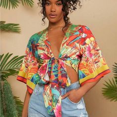 Super Cute And Stylish Ships In 5-10 Business Days Tropical V-neck Top For Summer, Colorful V-neck Blouse For Vacation, Tropical V-neck Top With Vibrant Print, V-neck Top With Tropical Print For Brunch, Colorful V-neck Blouse For Beach, Chic Yellow V-neck Crop Top, Fitted Tropical V-neck Top, Yellow Vibrant Print Short Sleeve Tops, Multicolor V-neck Top For Brunch