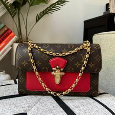 Brand New In Box Comes With Dustbag, Box And Receipts Hard To Take Pictures Of The Date Code. Length: 10.25 In Height: 6.5 In Width: 3.25 In Drop: 12.25 In Drop: 22 In This Chic Shoulder Bag Is Crafted Of Louis Vuitton Monogram Coated Canvas With A Cross-Over Flap. The Bag Features Polished Brass Bijoux Chain Link Shoulder Straps And A Facing Brass Press-Lock For The Flap. This Opens To A Front Patch Pocket And A Partitioned Black Microfiber Interior With A Zipper Compartment. Make A Reasonable Rectangular Monogram Canvas Shoulder Bag With Chain Strap, Elegant Monogram Canvas Box Bag With Dust Bag, Elegant Red Bags With Lock, Elegant Monogram Canvas Bags In Rectangular Case, Elegant Monogram Canvas Rectangular Case Bag, Formal Monogram Canvas Box Bag, Luxury Red Box Bag With Dust Bag, Luxury Red Bag With Lock, Luxury Red Box Bag With Detachable Strap