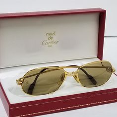 Vintage Authentic Cartier Sunglasses Gold Panthere Frame With Brown Lenses Unisex Size: 56-17-135 With Cartier Original Lenses, Comes With Cartier Box Gold/ Silver Hardware Some Signs Of Used & Vintage Wear Visible On The Tips By Cartier Logo Only. Still In Really Great Presentable Condition. Heavily Gold Electroplated Finish Guaranteed By Cartier To Last A Lifetime. These Always Stay Classic And Never Go Out Of Style Super Cool Fantastic Vintage Classic And Elegant Shades. $849 Firm Classic Rimless Sunglasses For Formal Occasions, Formal Yellow Gold Sunglasses With Gradient Lenses, Classic Cartier Sunglasses For Formal Occasions, Classic Cartier Sunglasses With Tinted Lenses, Classic Cartier Sunglasses With Mirrored Lenses, Classic Cartier Tinted Sunglasses, Formal Cartier Sunglasses With Gradient Lenses, Elegant Cartier Sunglasses With Mirrored Lenses, Modern Cartier Sunglasses For Formal Occasions