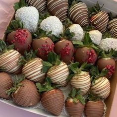 chocolate covered strawberries are arranged in a box