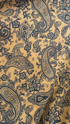 a blue and yellow paisley print fabric