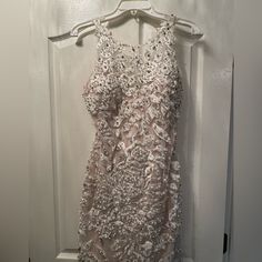 Jovani Dress. Perfect For An Engagement Party. Worn Once. Cups Are Sewn In Already. A Little Of Makeup Stains On The Inside. As Shown In The Picture. Size 8 But Taken In To Fit Like A 6! Elegant Floral Embellished Mini Dress For Prom, Embellished Lace Mother Of The Bride Dress For Party, Elegant White Sequin Dress For Prom, Glamorous Pearl Embroidered Prom Dress, Evening Lace Dresses With Pearl Embroidery, Party Dresses With Pearl Embroidery And Fitted Bodice, Party Dresses In Lace With Pearl Embroidery, Lace Dresses With Pearl Embroidery For Party, Glamorous Evening Dress With Pearl Embroidery