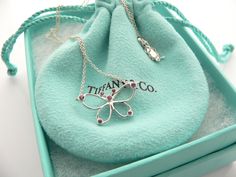 Overview:Do you know which items made Tiffany a world renowned company? You just stumbled upon one of them! Offered for sale is a wonderful and very rare Tiffany and Co. Sterling Silver and Pink Sapphires Butterfly necklace. The necklace is made from solid and substantial Tiffany silver, yet has a very delicate and feminine feel to it. Hanging from its substantial and bright Tiffany Sterling Silver curb chain is beautiful Butterfly pendant accented with 7 bright and sparkly Pink Sapphire gemston Luxury Diamond Necklace For Collectors, Designer Silver Jewelry With Hallmarks, Designer Engraved Necklace For Gift, Designer Hallmarked Jewelry For Collectors, Designer Engraved Necklaces For Formal Occasions, Designer Polished Finish Necklace Gift, Designer Silver Collectible Jewelry, Luxury Necklace For Valentine's Day, Designer Red Jewelry For Anniversary