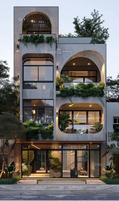 an apartment building with plants growing on the balconies