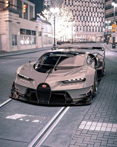 two bugatti cars parked on the street at night