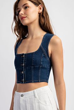 Unleash your inner fashionista with our Karlee Denim Crop Top. Made with stretch denim, this sleeveless button-front top is a stylish statement piece that effortlessly hugs your curves. Perfect for pairing with high-waisted skirts or jeans. You'll be turning heads wherever you go! Neckline: Square Neck Length: Cropped Sleeve length: Sleeveless Sleeve type: None Stretch: Slightly Stretchy Features: Button Up Front Sheer: No Care instructions: Machine wash cold. Tumble dry low. Product measurement Affordable Washed Blue Short Sleeve Denim Top, Denim Blue Sleeveless Crop Top, Cheap Cropped Medium Wash Denim Top, Cheap Blue Relaxed Fit Denim Top, Cheap Denim Blue Casual Crop Top, Cheap Dark Wash Denim Crop Top, Cheap Chic Washed Blue Denim Top, Cheap Denim Blue Sleeveless Crop Top, Affordable Denim Short Tops