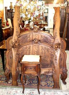 an ornate wooden bed frame in a store