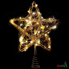 a lighted christmas star on top of a metal pole with lights in the shape of a star