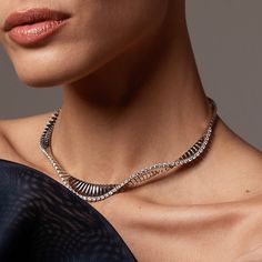 Ref. FF164NE42 Vito necklace, White Gold, White Diamonds. The Vito choker necklace, made of 18K white gold, gently ripples against the wearer's neckline and sparkles with white diamonds, emphasizing its natural movement. Gold: g 34.00 | White Dia: ct 3.15 | Sapphires: ct 0.04All weights are approximate. Slight variations may occur due to the nature of handmade craftsmanship.