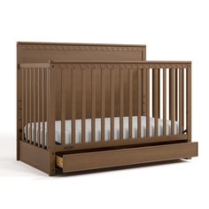 a wooden crib with white sheets on the bottom and side rails, in front of a white background