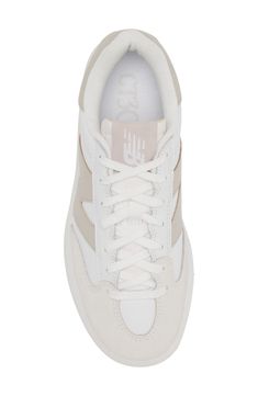 From the court to the street, this '80s-throwback tennis shoe scores new love as a sneaker made of leather and mesh with chunky proportions updating the look. The plush interior and supportive insole ground every step in game-winning comfort. Lace-up style Removable, cushioned insole with arch support Leather and textile upper/synthetic lining/rubber sole Imported Retro New Balance Sneakers With Round Toe, Retro New Balance Sneakers, Classic New Balance Sneakers With Gum Sole, White Mid-top Tennis Sneakers, New Balance Sporty Skate Shoes With Gum Sole, New Balance Low-top Skate Shoes With Gum Sole, New Balance Low-top Sneakers With Gum Sole, Retro White Sneakers With Rubber Waffle Outsoles, New Balance High-top Skate Shoes With Gum Sole