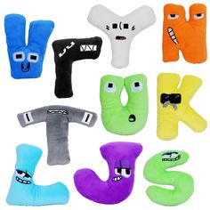 six different colored pillows with faces and eyes in the shape of letters k, m, d