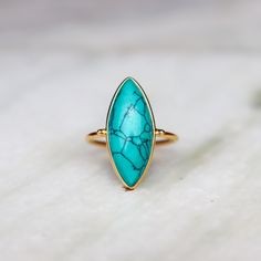 Gold Turquoise Ring | | Natural Copper Turquoise 18k Gold Plated Jewelry | Handmade | December Birthstone | Gold stacking ring | Gift Idea ❥ Metal: Solid sterling silver ❥ US Ring Size: Choose Size ✈ Free Shipping (USPS) ✈ Free Shipping to the United Kingdom 🎁 Free Gift Box ↻ 3 Days Return ⌛ 3 Day Handling Time ❥General Care Instructions ❥Remove jewelry when showering or bathing. This is particularly important when on the beach, in the sea, and in chlorinated water ❥Avoid wearing jewelry when doing physical work such as housekeeping, gardening, or exercise ❥Never expose jewelry to household cleaning products, especially bleach and highly reactive solutions ❥Avoid spraying perfume, or hairspray on the gemstones or pearls as it jeopardizes the integrity of the material ❥Remove jewelry when Stackable Turquoise Ring Fine Jewelry, Stackable Turquoise Ring In Fine Jewelry Style, Gold Turquoise Stackable Ring, Minimalist Turquoise Gemstone Stackable Rings, Elegant Turquoise Gemstone Stackable Rings, Elegant Turquoise Stackable Gemstone Rings, Adjustable Turquoise Ring Fine Jewelry, Blue Turquoise Stackable Open Ring, Fine Jewelry Turquoise Birthstone Ring