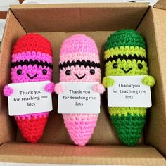 three crocheted candy cornucons in a box with thank you for teaching me lots