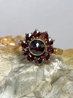 Condition excellent Full uk hallmarking 9ct gold 11 mixed cut garnets bezel and claw set Victorian Cluster Ring With Multi-stone, Victorian Multi-stone Cluster Ring, Vintage Multi-stone Cluster Ring, Antique Multi-stone Cluster Ring, Vintage Yellow Gold Flower Ring With Gemstone, Vintage Cluster Ring Suitable For Gifts, Vintage Garnet Birthstone Rings, Round Garnet Jewelry Stamped 14k, Vintage 14k Gold Cluster Jewelry