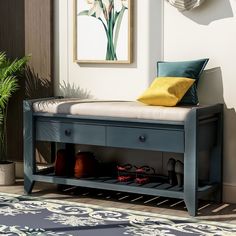 a blue bench with shoes underneath it in front of a painting and potted plant