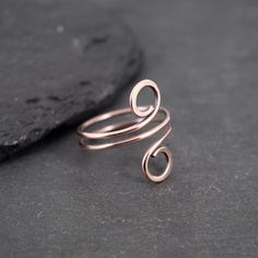 These rings are made with copper wire.  ✩ The item comes in a branded gift box- perfect for gifting.  ✩ All items are handcrafted by myself and every effort is taken to produce a high quality product.  ✩ If you have particular questions, send me a message! I am also doing jewelry upon request, so if you have an idea of what you want me to make for you, please get in touch to talk about it! Minimalist Hand Forged Stackable Rings For Gift, Minimalist Hand Forged Stackable Rings As Gift, Modern Twist Wire Wrapped Rings For Gifts, Modern Twist Wire Wrapped Rings As Gift, Wire Wrapped Rings As A Modern Gift, Minimalist Hand Forged Midi Rings As Gift, Handmade Minimalist Rose Gold Midi Rings, Adjustable Midi Rings With A Modern Twist For Gifts, Modern Twist Adjustable Midi Rings As Gift