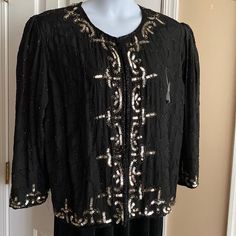 100% Silk Black Jacket Fully Lined With Black Beading Throughout In A Swirl Pattern And Beads Around Entire Neck/ Front Openings And Bottom. Silver Sequins And Topaz Beads Highlight Down Front Sides And Bottom Front, Around Sleeves And Upper Back Neck Edge. Hook And Eye Closures. Extra Beads Included. 21” Pit To Pit; 26” Shoulder To Bottom Hem New Condition Elegant Beaded Festive Outerwear, Glamorous Beaded Outerwear For Evenings, Glamorous Beaded Evening Outerwear, Black Beaded Winter Outerwear, Beaded Winter Evening Outerwear, Beaded Evening Outerwear For Winter, Ny Fashion, Swirl Pattern, Silver Sequin